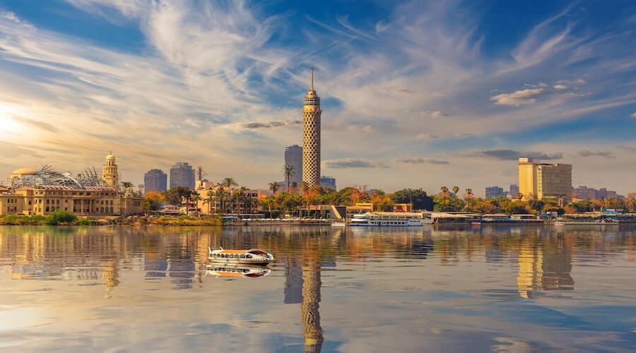 View of Cairo city with clear skies and the Pyramids of Giza, showing ideal travel conditions